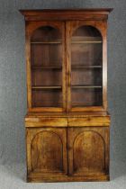 Library bookcase, mid 19th century flame mahogany in two main sections. H.223 W.120 D.60cm. (Some