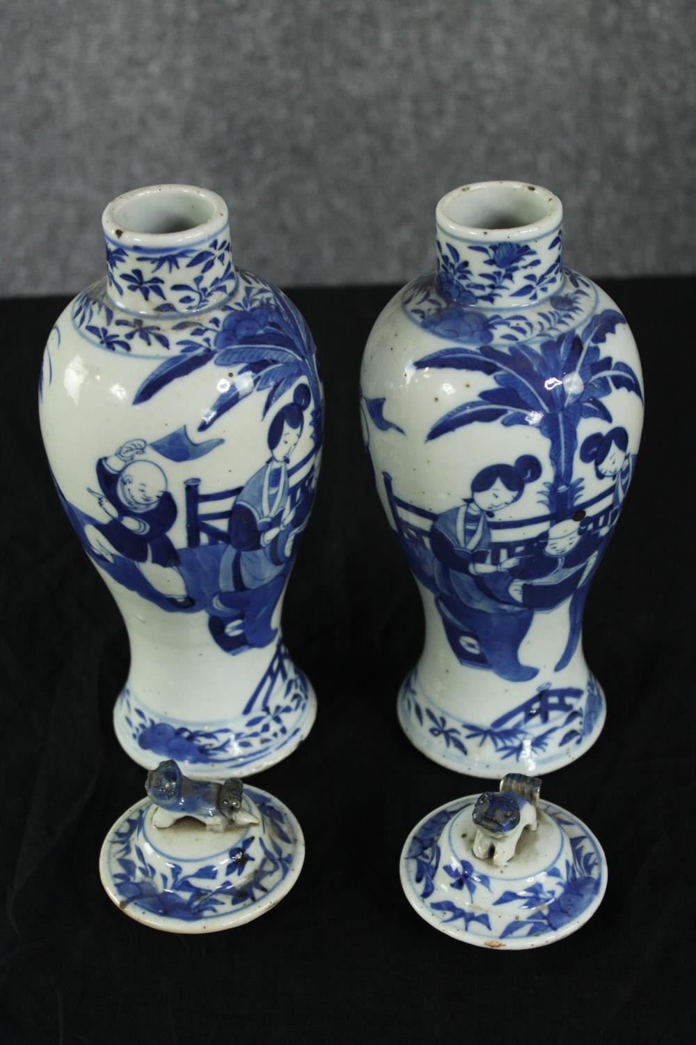 A pair of 19th century Chinese hand painted porcelain lidded urns. The lid finials in the form of - Image 2 of 5