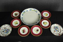 A mixed collection of plates and a charger. Including Booth's Pompadour pattern. The charger with