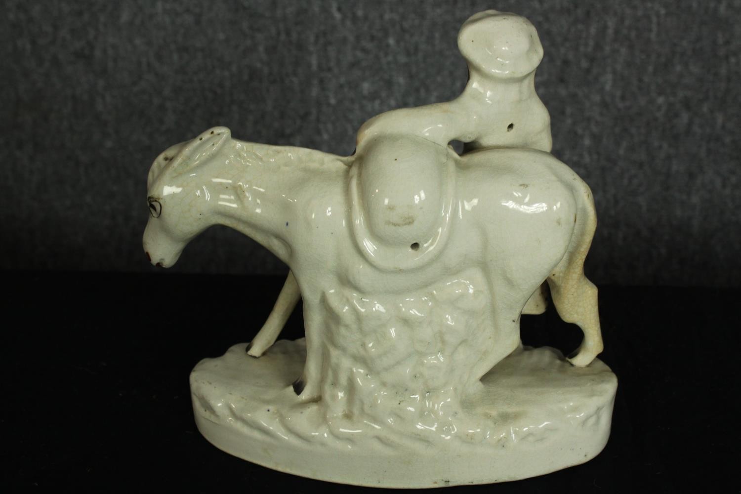 Staffordshire figure. 'Beesom'. A pedlar and donkey carrying sand. Circa 1880. H.21 x W.21 cm. - Image 3 of 4