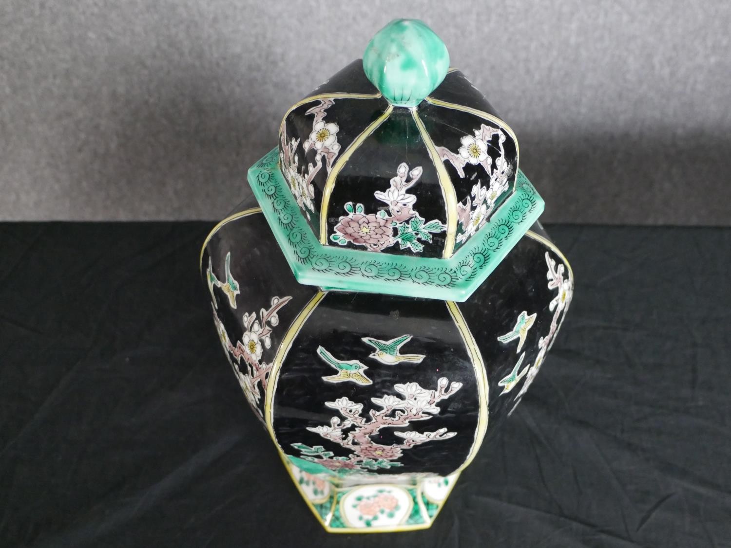 A late 20th century Chinese hexagonal form lidded ceramic urn with hand painted blossom tree and - Image 2 of 4
