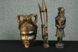 Two carved hardwood African figures and a mask. Twentieth century. H.46cm.