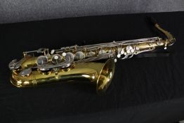 A Michael White Saxophone. Complete with its padded case. L.81 W.31 D.18 cm.