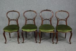 Dining chairs, a set of four Victorian, carved walnut.