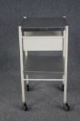 A metal framed medical type trolley on casters. H.90 W.46 D.46cm.