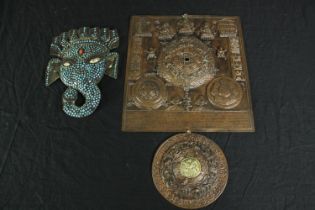 Two metal plaques. An elephant decorated with turquoise glass and coral. Also, a Buddhist Mandala