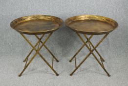 A pair of gilt metal folding serving tables. H.65 Dia.66cm. (each)