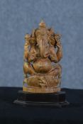 Ganesha Supreme God of the Ganapatya. Carved hardwood figure on a plinth. Probably mid twentieth