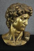 A gold painted resin bust of Michelangelo's David. H.58 W.43 D.23 cm.