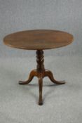 Occasional table, early 19th century oak with tilt top action. H.76 Dia.88cm.