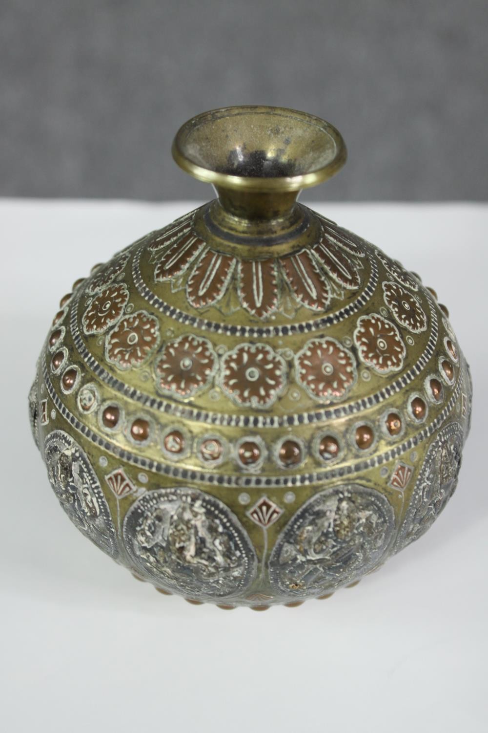 An Indian inlaid copper and white metal brass bottle along with a pair of pokerwork lidded jars - Image 4 of 7