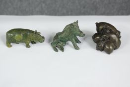 A carved green hardstone hippo along with a seated boar and a pile of bronze resin pigs. H.6 W.7 D.