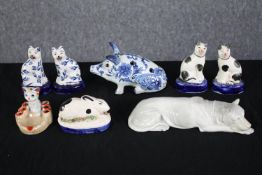 A pair of Staffordshire style porcelain cats together with porcelain hound, hand painted pig and