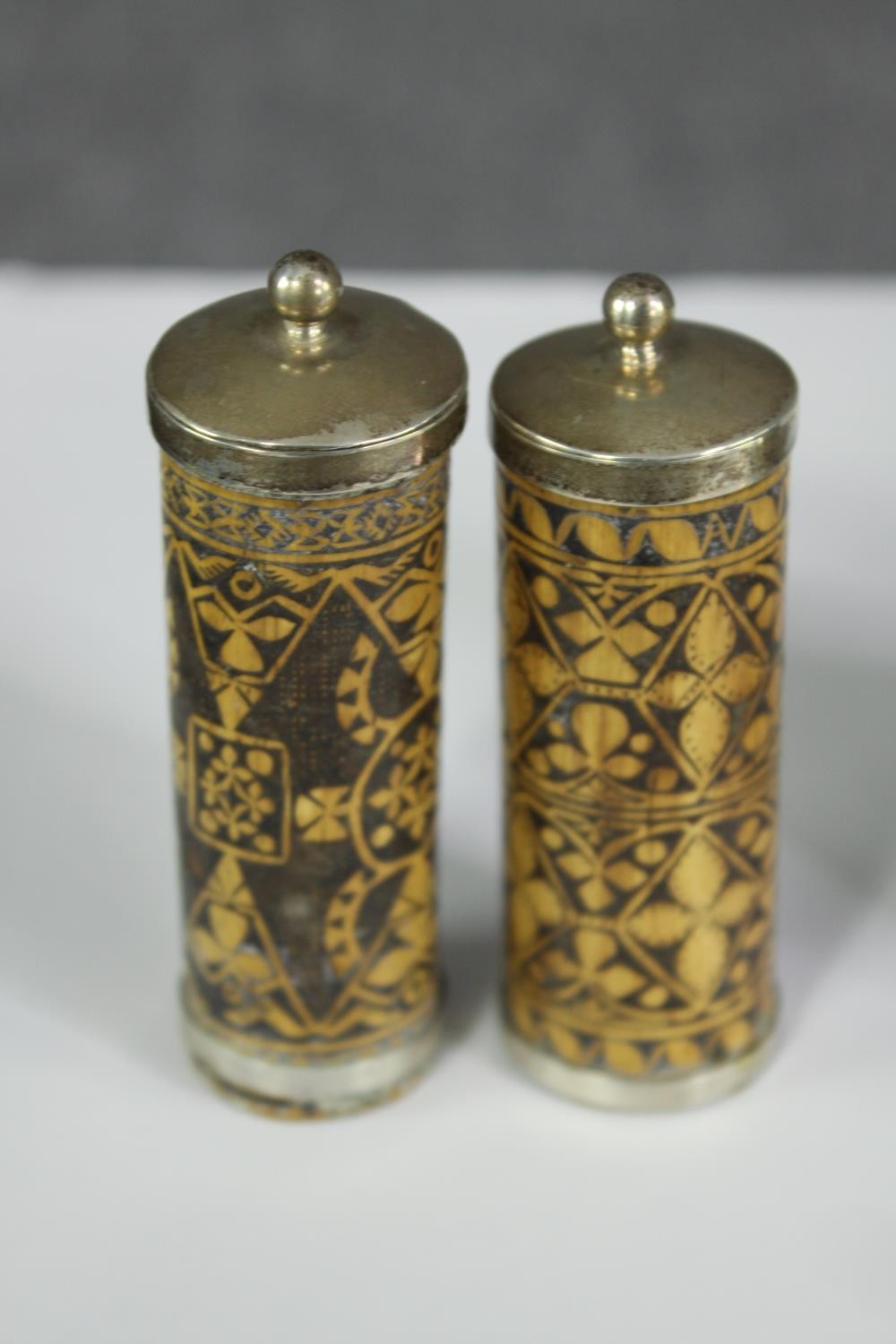 An Indian inlaid copper and white metal brass bottle along with a pair of pokerwork lidded jars - Image 2 of 7