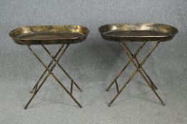 A pair of gilt metal folding serving tables. H.67 W.69 D.40cm.