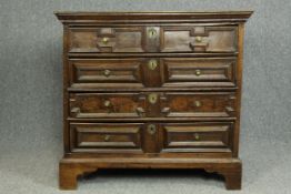Chest of drawers, Jacobean oak with lozenge moulding to drawer fronts raised on shaped bracket feet.