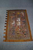 An early 20th century Indian silk wall hanging with sequin embellishment decorated with deities on