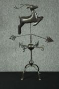 A weather vane in the shape of a stag. H.80 cm.
