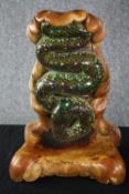 A ceramic and mirrored mosaic wall mounted plant shelf with sculpted green serpent adorned with