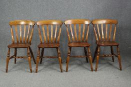 Kitchen dining chairs, a set of four, elm Windsor style.