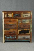 A contemporary distressed polychrome painted chest of drawers. H.100 W.100 D.40cm.