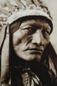 A large photographic portrait of a Native American. Framed. H.90 W.73 cm.
