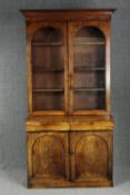 Library bookcase, mid 19th century flame mahogany in two main sections. H.223 W.120 D.60cm. (Some