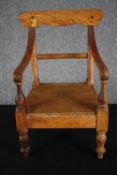 A mid 19th century child or doll's armchair. H.54cm.