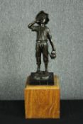 A bronze figure on a wooden plinth. Boy carrying water. Signed by the artist and with a Parisian