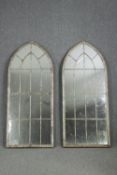 A pair of large Gothic arched metal framed mirrors. H.158 W.67cm. (each)