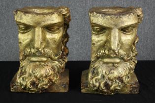Two gilt resin busts. Sections of classical faces. each measures H.40 W.30 D.28 cm.