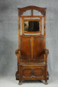 Hallstand, mid century oak in an antique style fitted with seat and storage section. H.190 W.90 D.