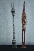 African tribal art. Two figures. One with braided headdress. Twentieth century. H.103 cm. (largest)