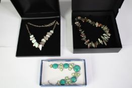 Three boxed statement gem set necklaces. A Jasper and black fresh water pearl necklace, a pearl