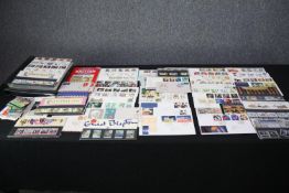 A large stamp collection of first day covers and first issue stamps. Also, an album of Liberia