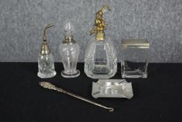 A collection of silver and cut glass dressing table items, including an Art Deco atomiser with