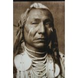 A large modern decorative print of a Native American. Framed and glazed. H.90 W.73 cm.