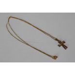 A 9ct gold cross and chain set with paste stones. Hallmarked 9ct. Chain Length 44cm, pendant H.2cm