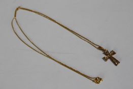 A 9ct gold cross and chain set with paste stones. Hallmarked 9ct. Chain Length 44cm, pendant H.2cm