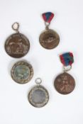 Four 19th century Napoleon III medals and a medal/brooch. Three bronze medals, one with shaking