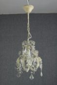A small chandelier of just one light surrounded by tear and pear drop glass. H.63 Dia. 25cm.