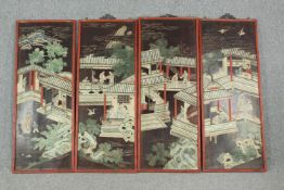 A four piece early 20th century lacquered and painted Japanese temple scene on four panels, with