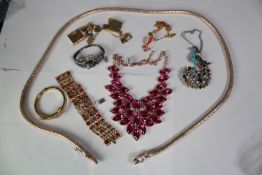 A collection of 20th century paste set jewellery, including a statement pink paste panel necklace, a