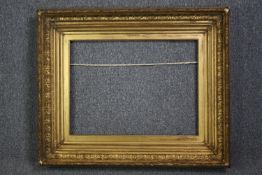 A large nineteenth century giltwood and gesso frame. H.85 W.100 cm.