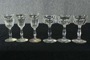 A collection of six 19th century petal faceted liqueur glasses, two sets of three. H.13cm. (largest)