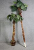 Two artificial palms. The largest measures H.260 cm.