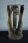 Occasional table, African carved hardwood with figural support. H.59 Dia.31cm.