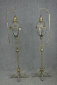 A pair of gilt metal floor standing candle lanterns on stands. Twentieth century. Each measures H.