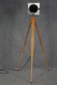 Modern theatre style spot lamp on wooden tripod. H.160 cm.