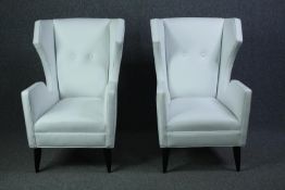 Armchairs, a pair, contemporary wingback in white studded leather upholstery. H.102 W.74 D.80cm. (